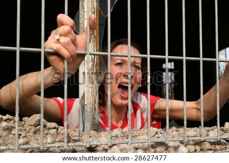 woman behind bars screaming