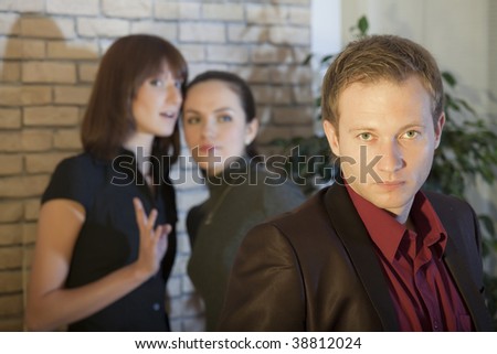 two female friends talking about man behind his back