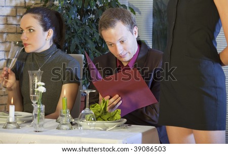 surprised man checking the bill in a restaurant