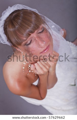 sad bride crying in studio - shot from above