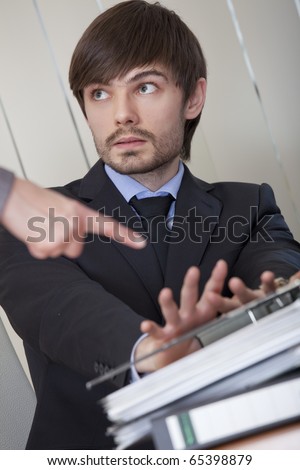 office scene - business man rejecting office work