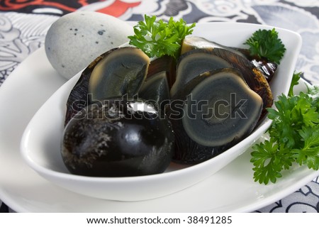 Century eggs are preserved in a special process, giving the eggs a distinct look and taste. Also known as preserved eggs or thousand-year eggs.
