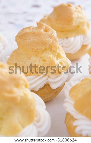 Baked cream puffs filled with pastry cream.