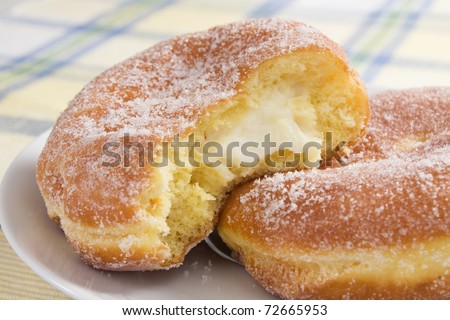 Deep-fried doughnuts (paczki) filled with cream cheese are eaten on Fat Tuesday before Lent.