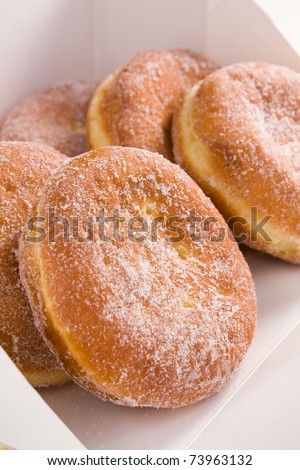 Deep-fried filled doughnuts (paczki) eaten on Fat Tuesday before Lent.
