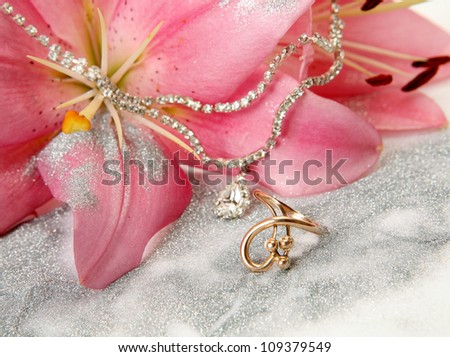 Gold ring and pink lilies