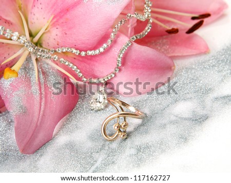 Pink lilies and gold ring