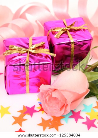Box with a gift and rose