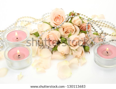 Fine roses and burning candles