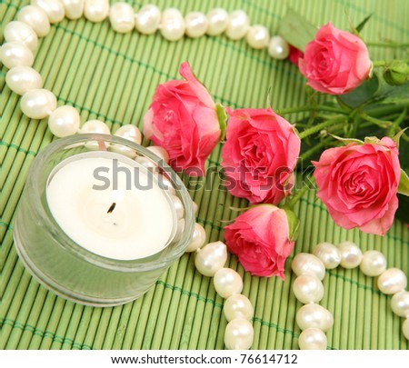 Pink roses and candles
