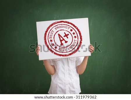 student shows his grade, holding a paper with a stamp A plus grade overhead