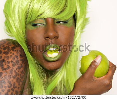 Woman in Green Wig With Green Apple