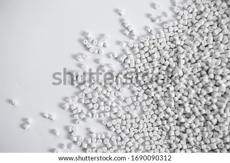Polypropylene granule close-up background texture. plastic resin ( Masterbatch).Grey chemical granules for industrial plastic production Foto d'archivio © 
