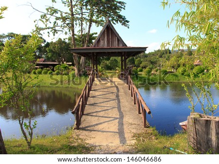 Pavilion on bridge on water in resort