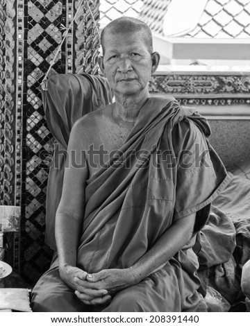 Ratchaburi, Thailand - May 24, 2014: Buddhist monk poses for a photo at buddhist temple from Damnoen Saduak Floating Market, Thailand.Buddhism is the primary religion in Thailand.