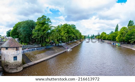 York, United Kingdom - August 9, 2014: View over River Ouse and bridge in the city of York, UK.York is a historic walled city at the confluence of the Rivers Ouse and Foss in North Yorkshire, England.