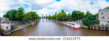 York, United Kingdom - August 9, 2014: View over River Ouse and bridge in the city of York, UK.York is a historic walled city at the confluence of the Rivers Ouse and Foss in North Yorkshire, England.
