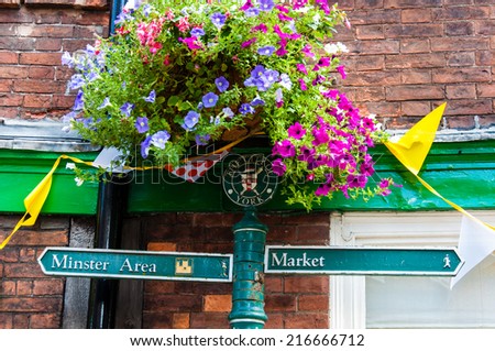 York, United Kingdom - August 9, 2014: Closeup on tourist Sign posts in city of York, UK.York is a historic walled city at the confluence of the Rivers Ouse and Foss in North Yorkshire, England.