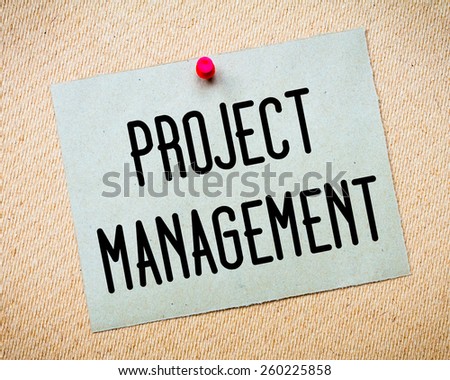 Recycled paper note pinned on cork board. Project Management Message. Concept Image