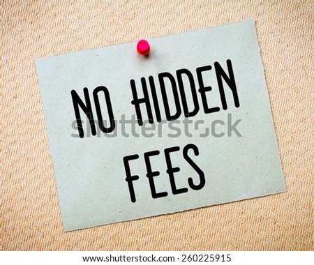 Recycled paper note pinned on cork board. No Hidden Fees Message. Concept Image