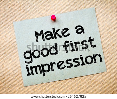 Make a first good impression Message. Recycled paper note pinned on cork board. Concept Image