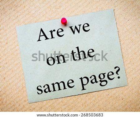 Are We On The Same Page? Message. Recycled paper note pinned on cork board. Concept Image