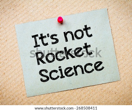 It\'s Not Rocket Science Message. Recycled paper note pinned on cork board. Concept Image