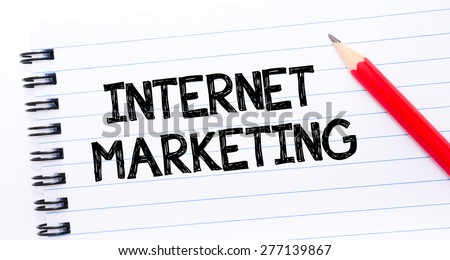 Internet Marketing Text written on notebook page, red pencil on the right. Concept image