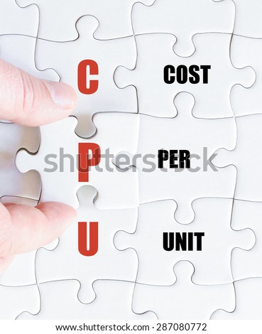 Hand of a business man completing the puzzle with the last missing piece.Concept image of Business Acronym CPU as Cost Per Unit