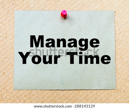 Manage Your Time written on paper note pinned with red thumbtack on wooden board. Business conceptual Image