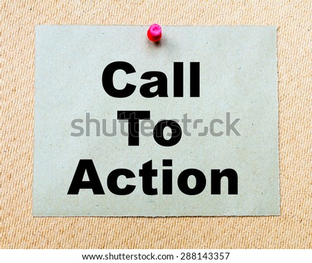 Call To Action written on paper note pinned with red thumbtack on wooden board. Business conceptual Image