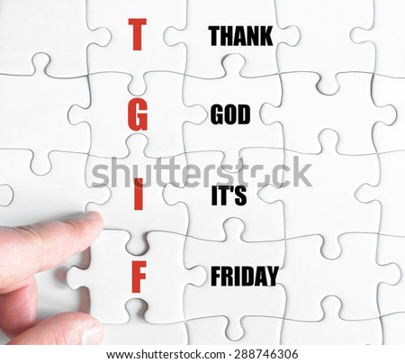 Hand of a business man completing the puzzle with the last missing piece.Concept image of Business Acronym TGIF as Thank God It\'s Friday