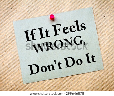 If It Feels Wrong, Don\'t Do It Message written on recycled paper note pinned on cork board. Motivational concept Image