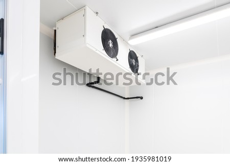 an empty industrial room refrigerator with four fans Stock foto © 