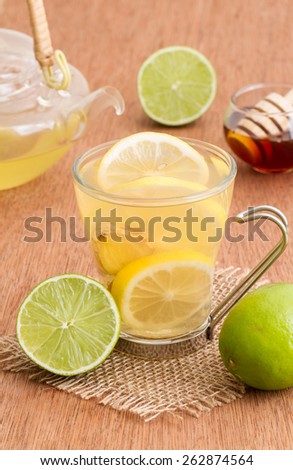 English tea with lemon. Herbal tea and honey on wooden background