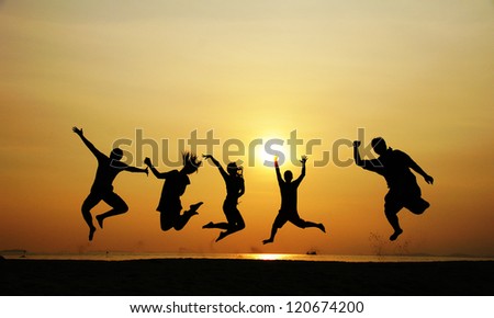 People jumping on the beach