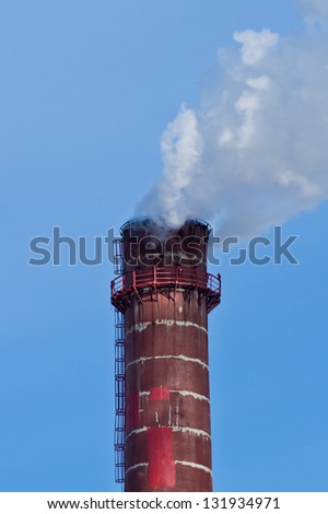Smoke coming out of power plant chimney