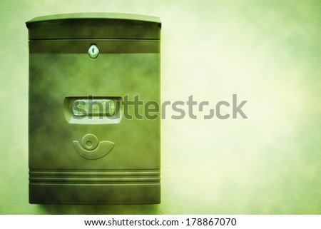 green mailbox on white background