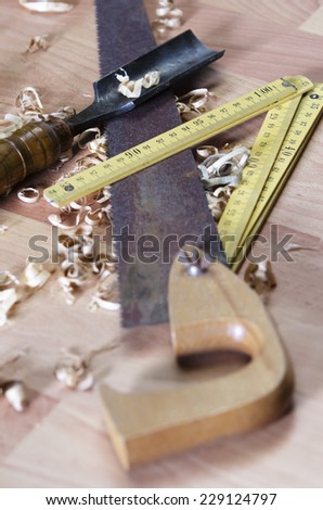 Old carpentry tools on a wooden table