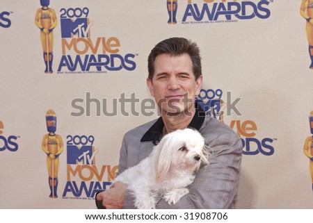 UNIVERSAL CITY, CA - MAY 31: Musician Chris Isaak and his dog Rodney arrive at the 2009 MTV Movie Awards at the Gibson Amphitheater on May 31, 2009 in Universal City, California