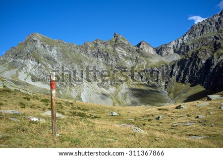 Wonderful view of the swiss mountains with indication pole
