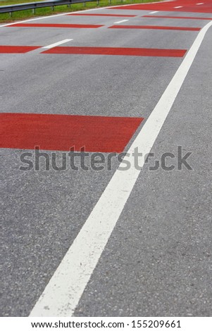 Road with white and red lines