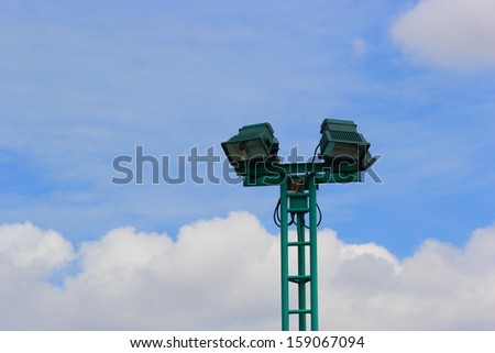 Light poles in the park , spotlights post on blue sky