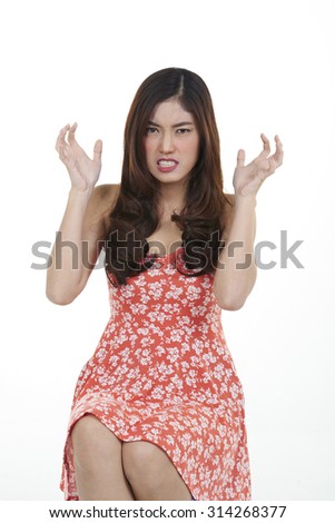 unhappy stressed angry young woman shooting in white background