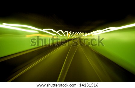 Abstract auto tunnel in Amsterdam with green blurred lights