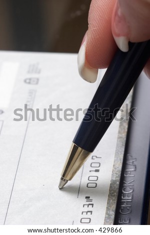 Woman signing check