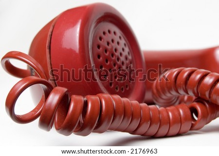 close up of old antique style red telephone receiver