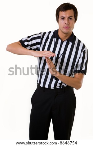 Young brunette man wearing a referee striped black and white top making the time out signal