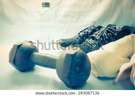Pair of sport shoes and fitness accessories - Vintage retro picture style