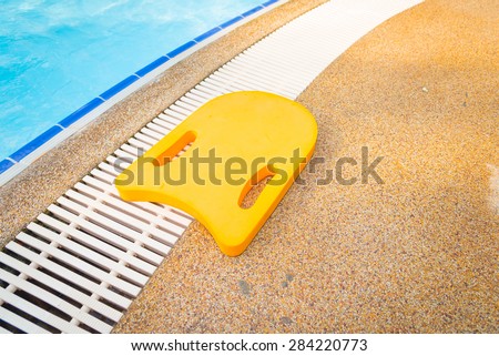 Foam board for the teaching of swimming beside swimming pool